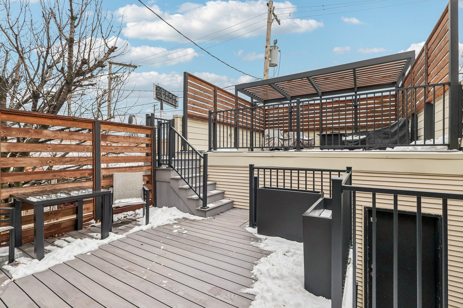 3137 North Spaulding Avenue Chicago, IL 60618 - Photo 33 of 42 a roof deck view with a chair and table