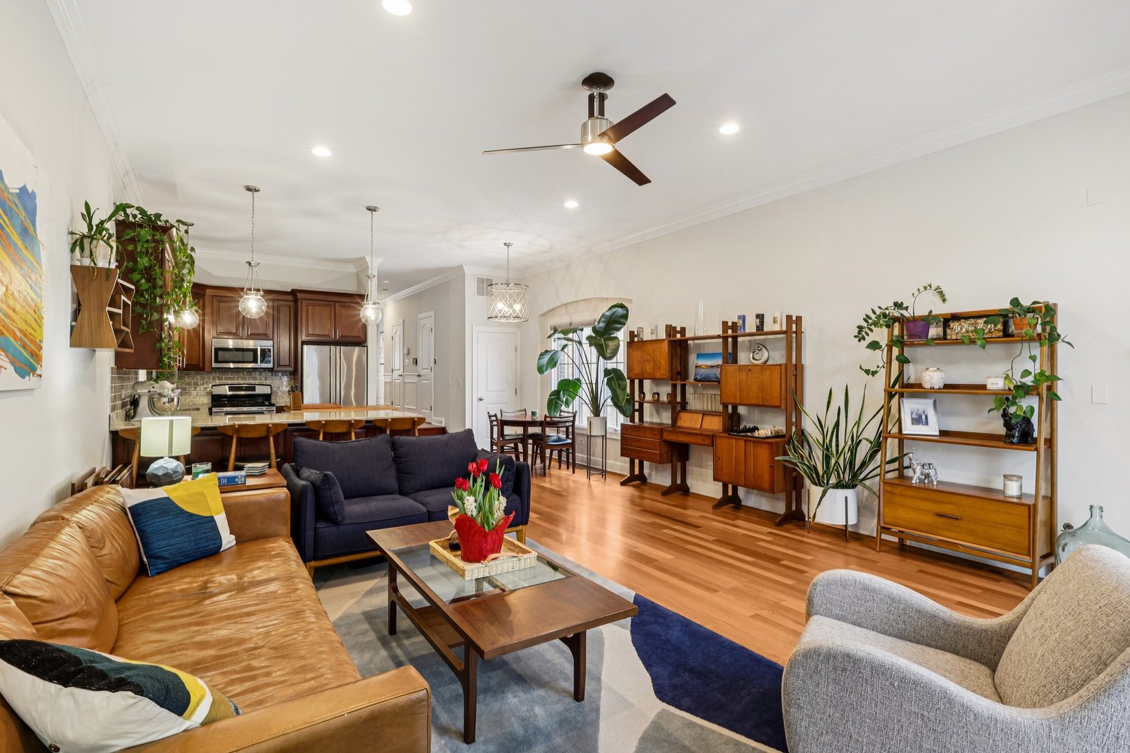3137 North Spaulding Avenue Chicago, IL 60618 - Photo 10 of 42 a living room with furniture kitchen view and a wooden floor