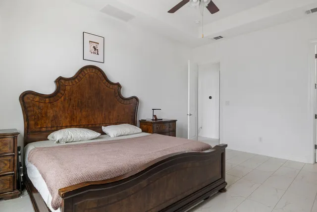 a bedroom with a bed and with furniture