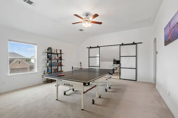 a dining room with furniture and window