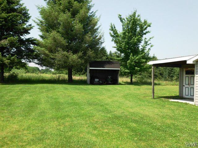 266 Correll Road Kunkletown, PA 18058 - Photo 18 of 24 a view of a backyard with a garden and entertaining space