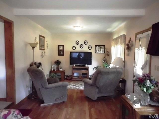 266 Correll Road Kunkletown, PA 18058 - Photo 8 of 24 a living room with furniture a flat screen tv and a fireplace