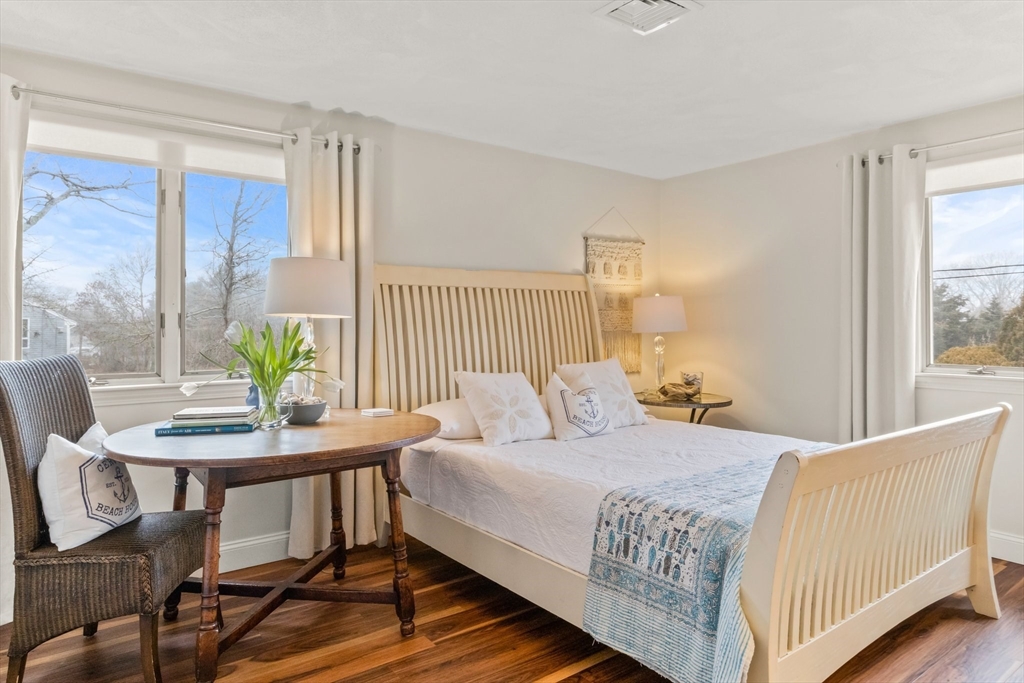 1 Captain Towne Road East Sandwich, MA 02537 - Photo 16 of 35 a bedroom with a bed and a table