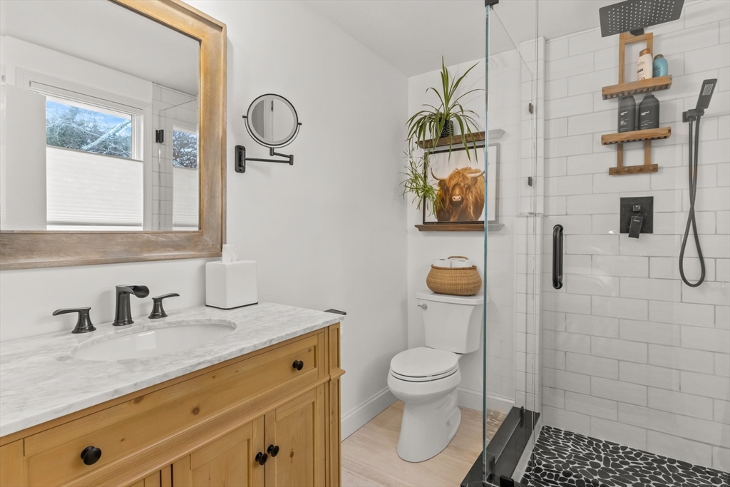 1 Captain Towne Road East Sandwich, MA 02537 - Photo 23 of 35 a bathroom with a granite countertop sink toilet and shower