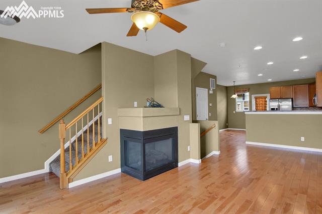 811 Weber Ridge Point Colorado Springs, CO 80903 - Photo 8 of 32 Living room with stairs going up to bedrooms