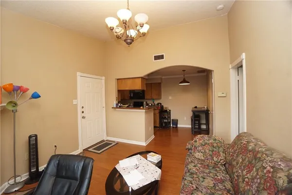 a bedroom with furniture and a chandelier