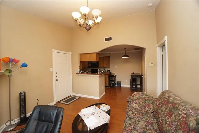 a bedroom with furniture and a chandelier