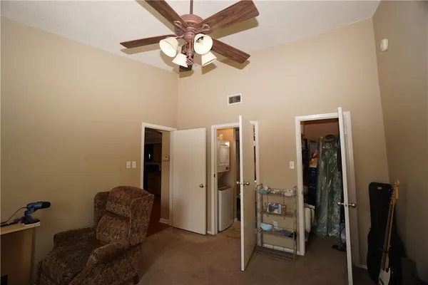 wooden floor and chandelier fan in a room