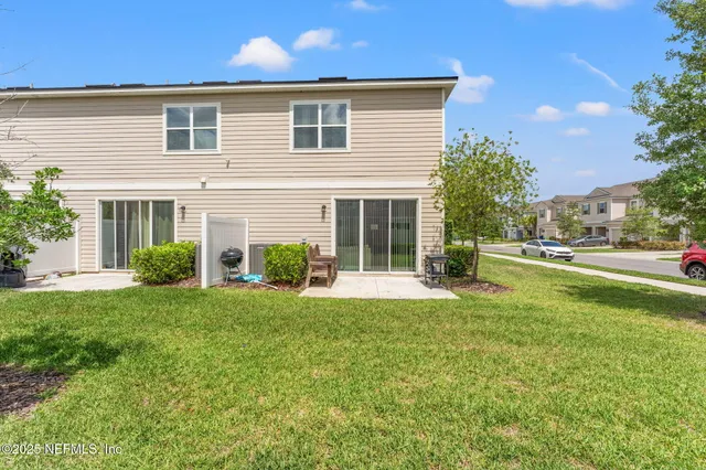 a house view with a sitting space and garden