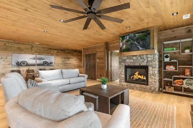 a bed sitting in a spacious bedroom next to a window