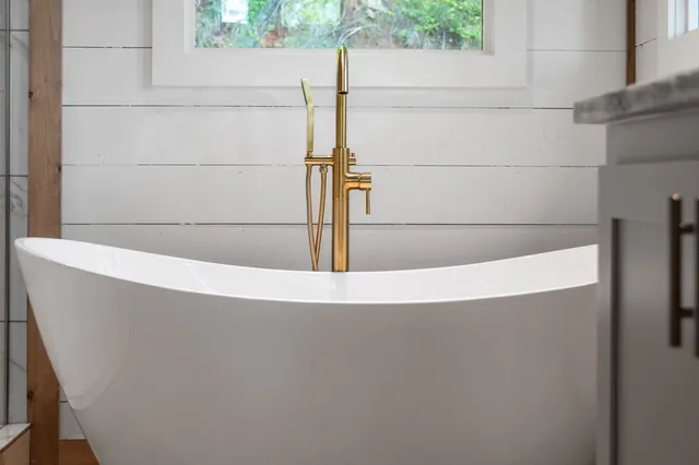 a view of a backyard with plants and a patio