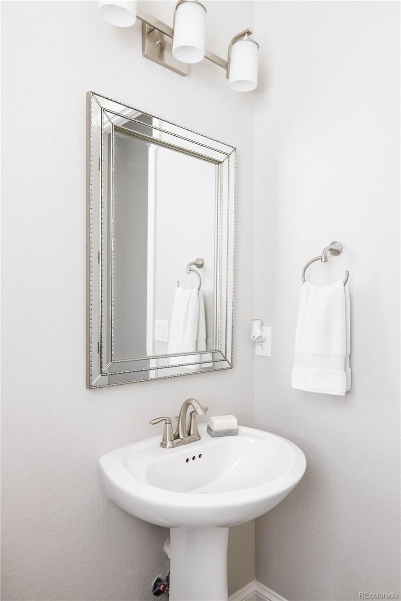3966 Breakcamp Court Castle Rock, CO 80108 - Photo 19 of 46 a bathroom with a sink and a mirror