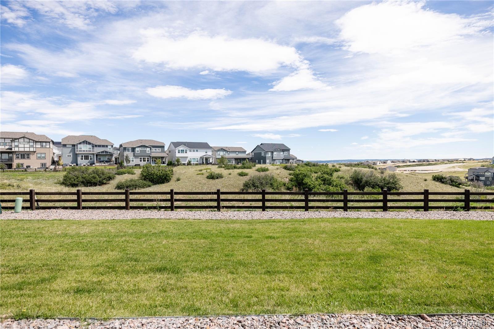 3966 Breakcamp Court Castle Rock, CO 80108 - Photo 42 of 46 a view of a lake with houses