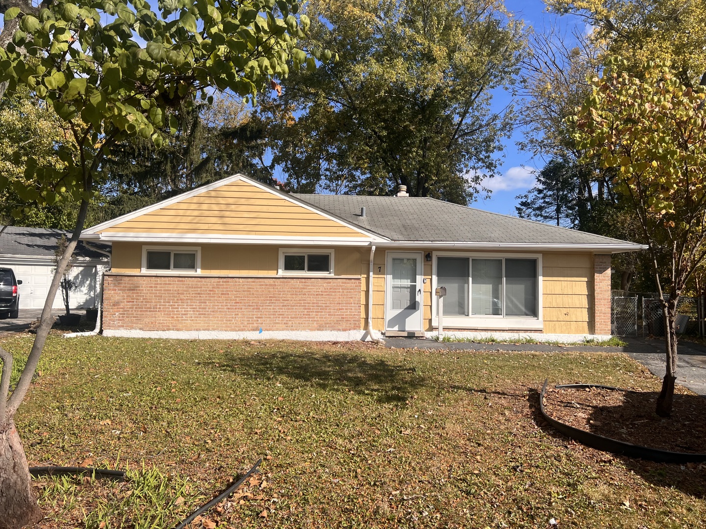 front view of a house with a yard