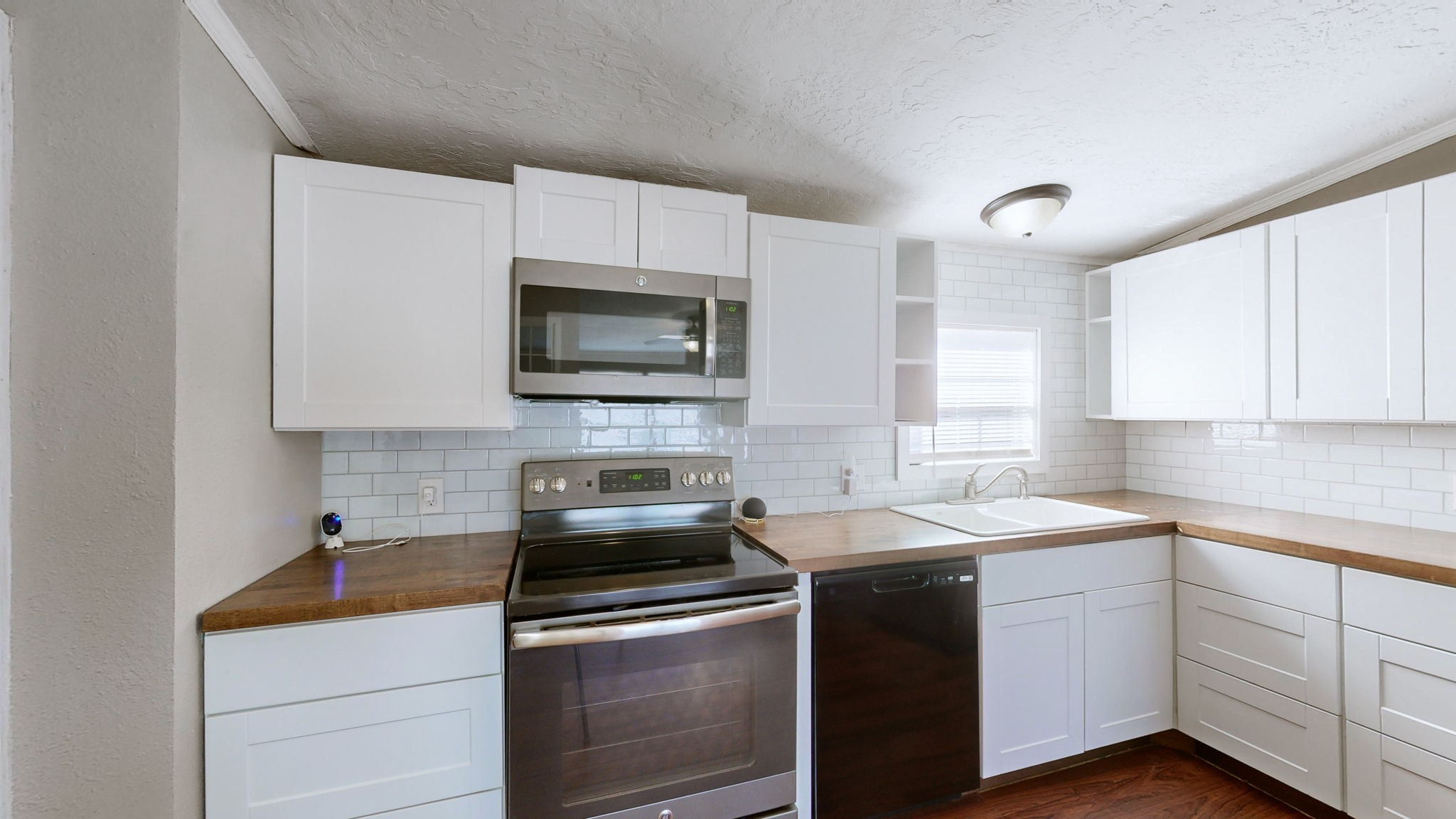574 Benson Road Manchester, TN 37355 - Photo 11 of 41 a kitchen with a sink stove and microwave