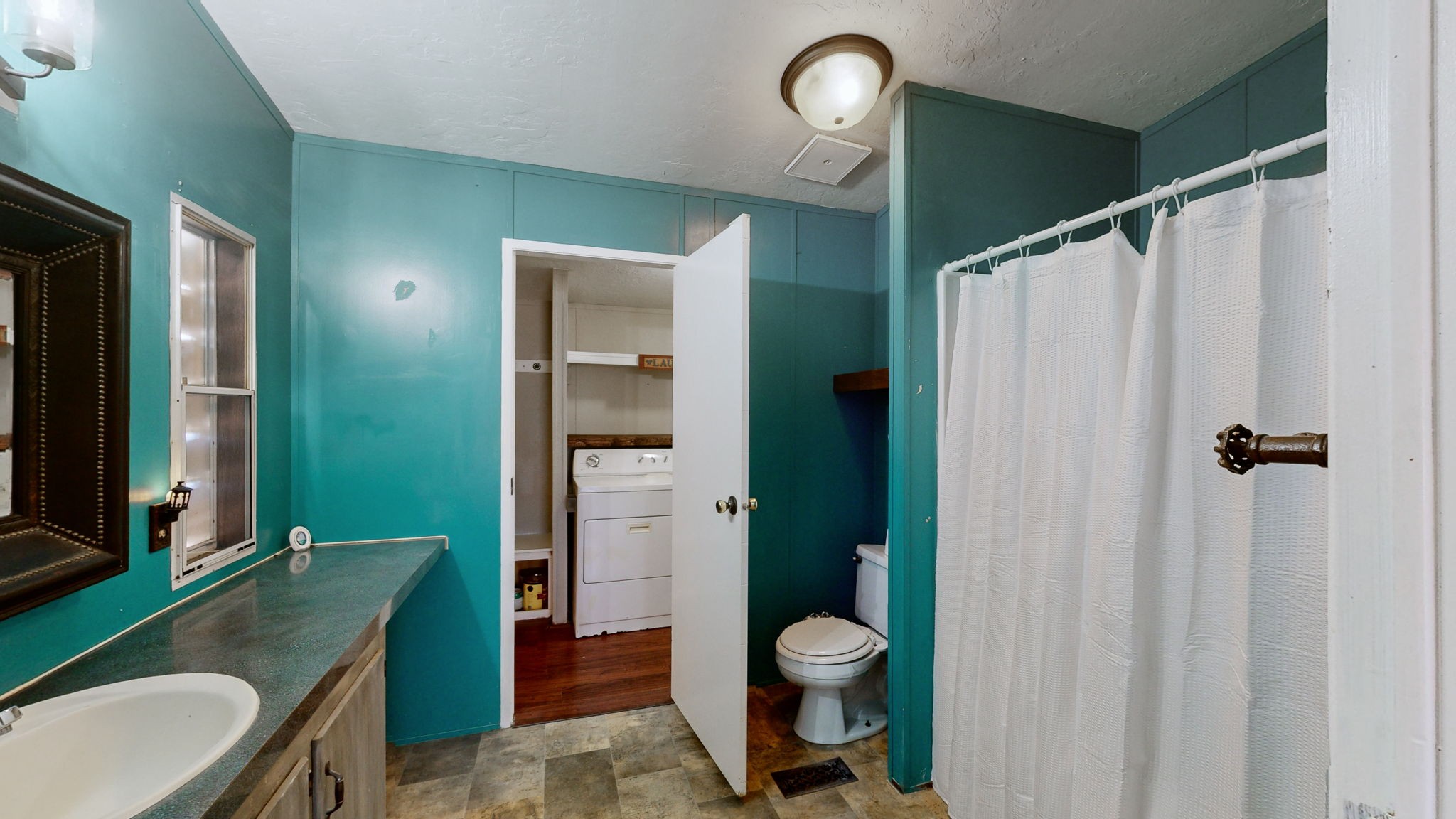 574 Benson Road Manchester, TN 37355 - Photo 15 of 41 a bathroom with a toilet a sink and shower