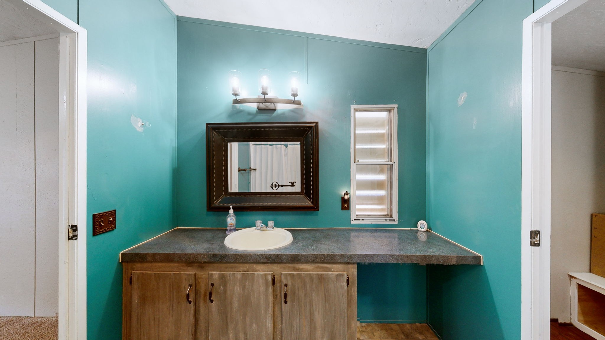 574 Benson Road Manchester, TN 37355 - Photo 16 of 41 a bathroom with a sink and a mirror