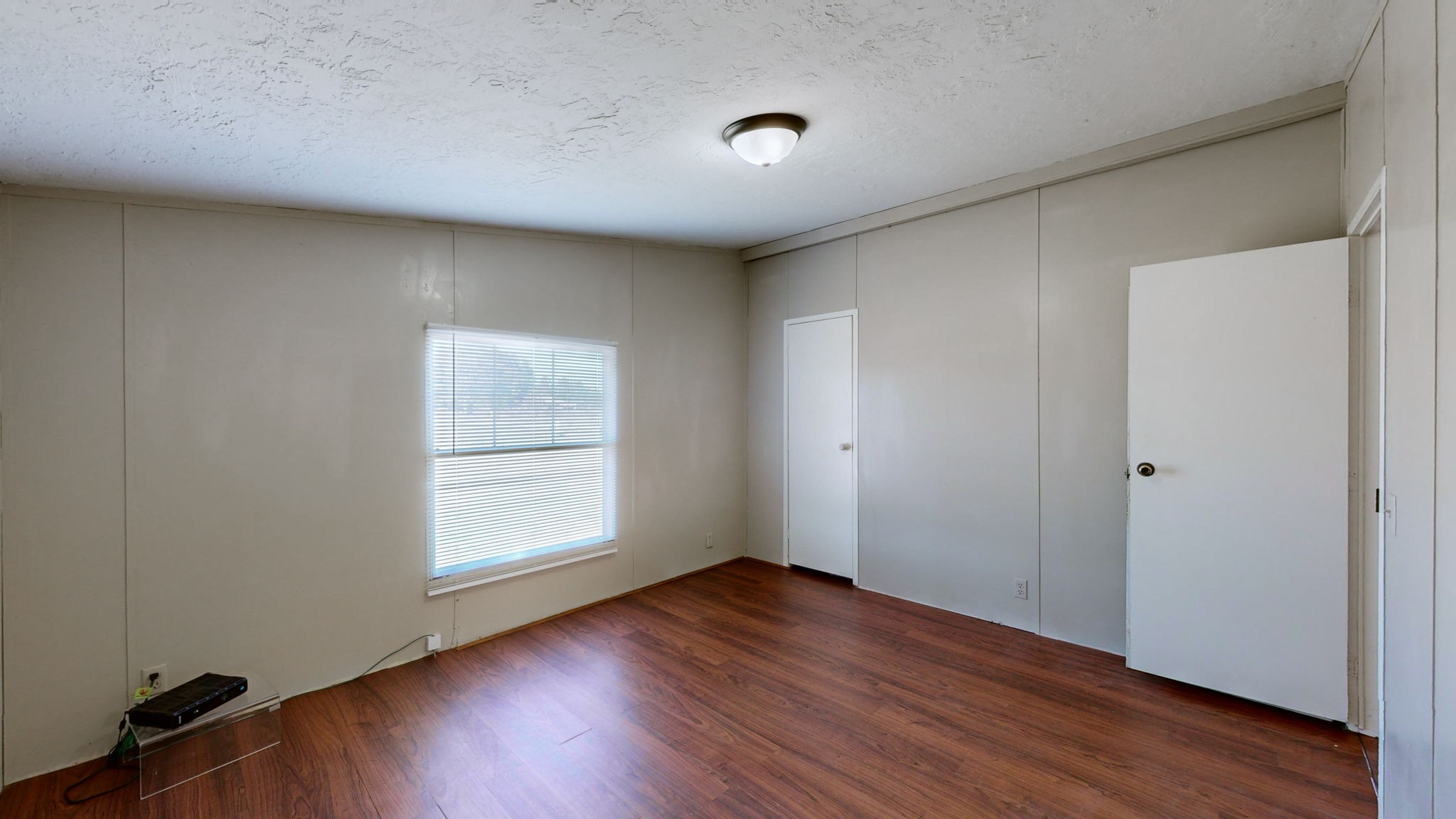 574 Benson Road Manchester, TN 37355 - Photo 22 of 41 an empty room with wooden floor and windows