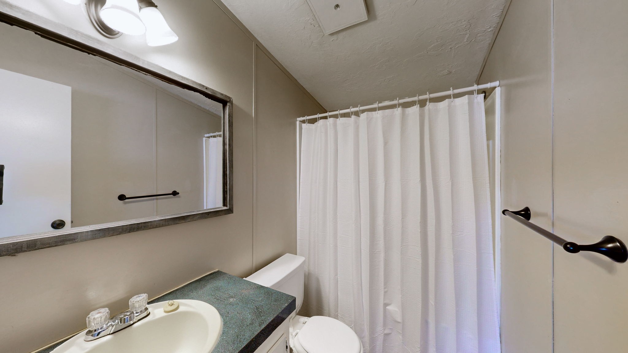 574 Benson Road Manchester, TN 37355 - Photo 23 of 41 a bathroom with a sink mirror and toilet