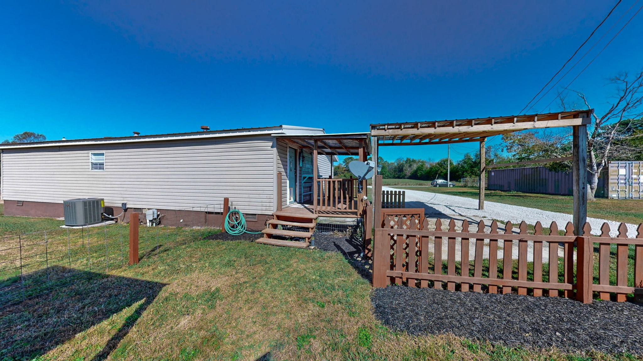 574 Benson Road Manchester, TN 37355 - Photo 28 of 41 a view of a house with backyard and sitting area