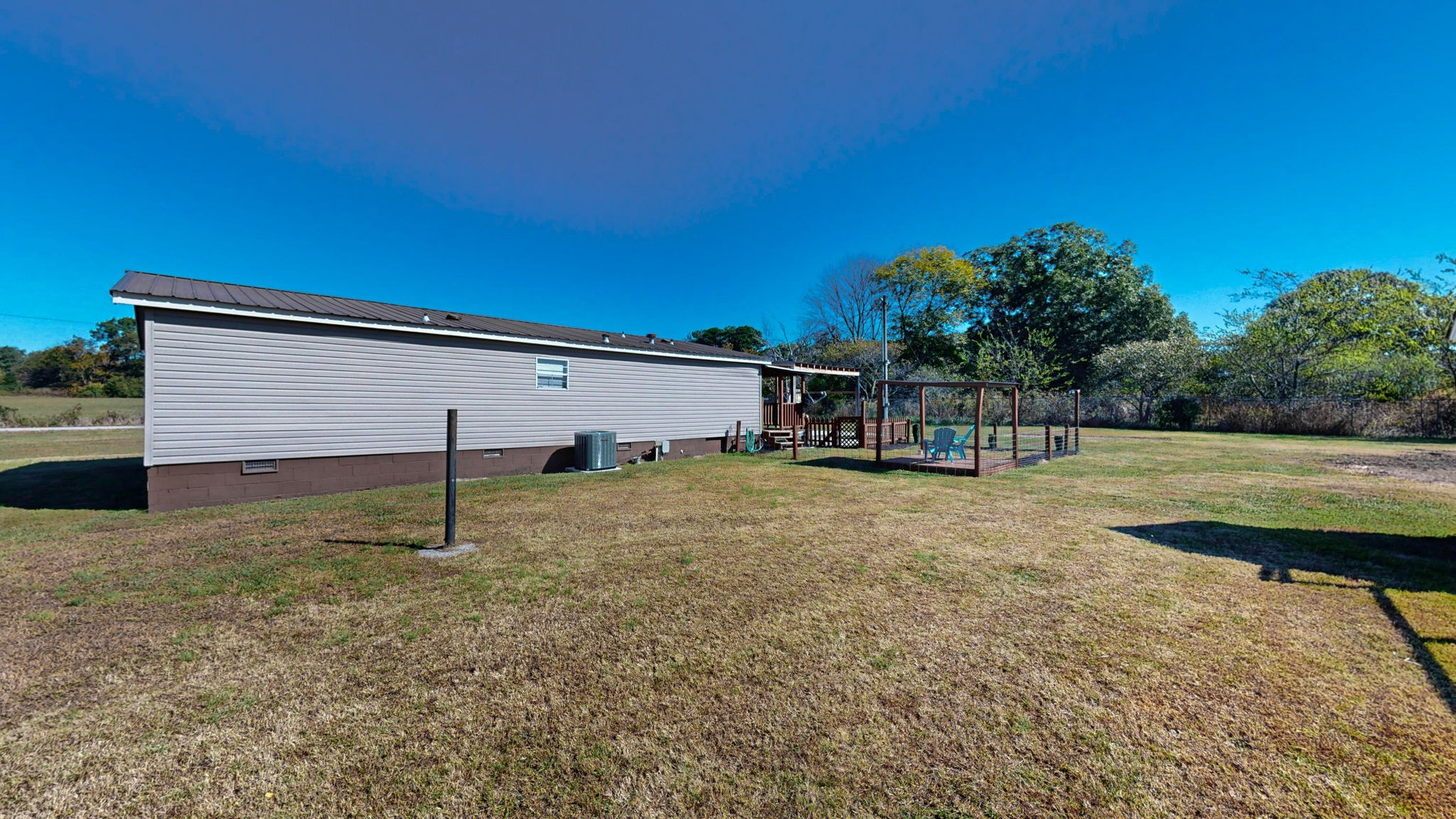 574 Benson Road Manchester, TN 37355 - Photo 36 of 41 a backyard of a house with lots of green space