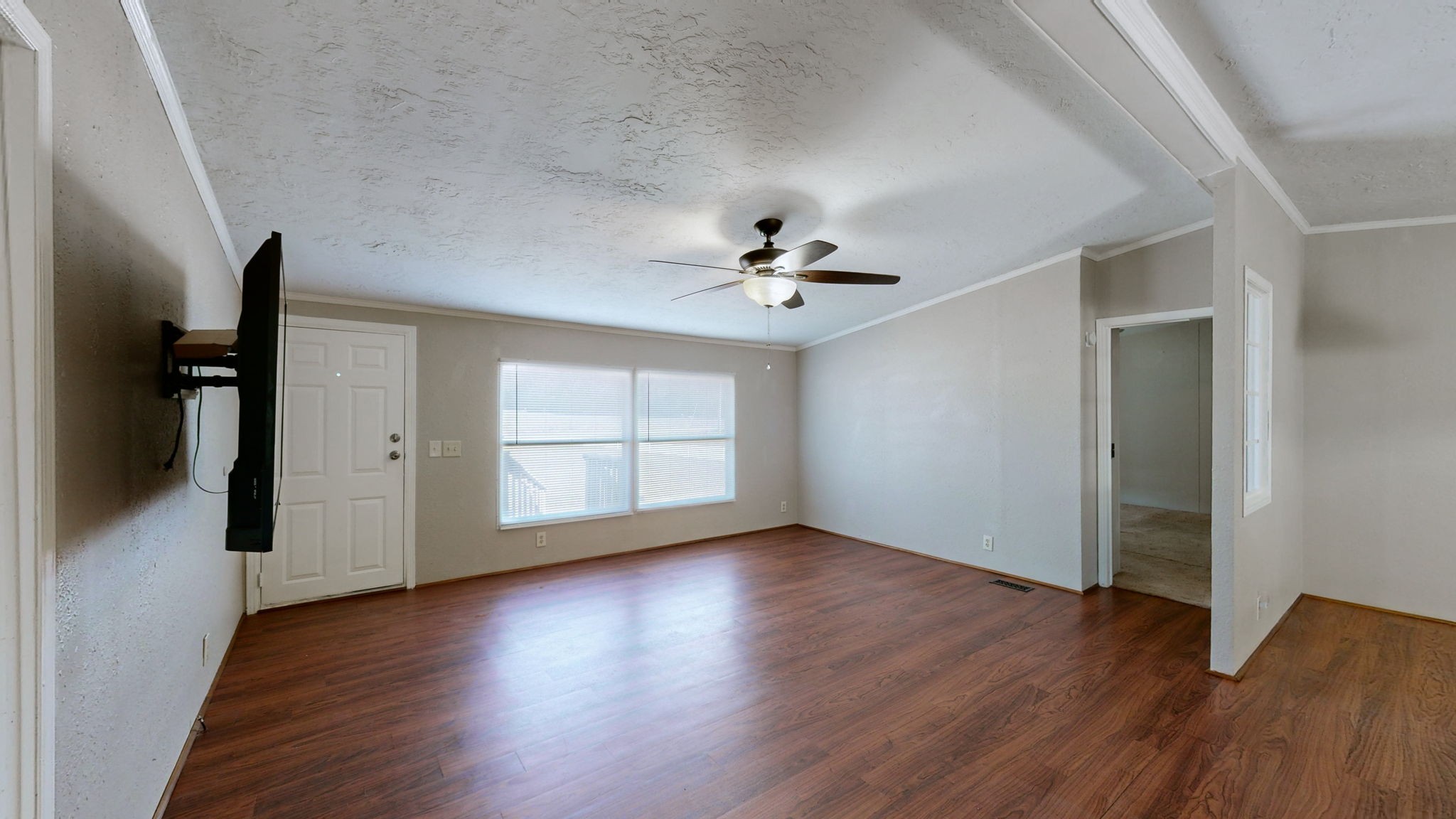 574 Benson Road Manchester, TN 37355 - Photo 5 of 41 a view of an empty room with wooden floor and a window
