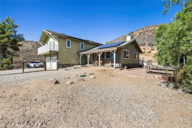 a view of a house with snow on the road