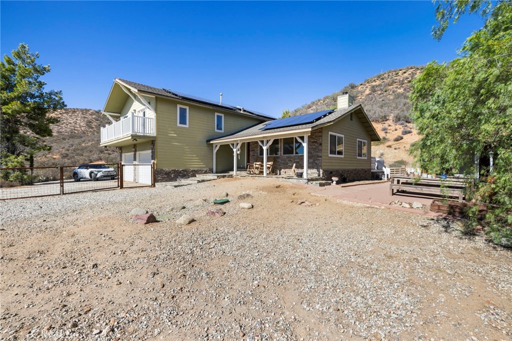 a view of a house with snow on the road