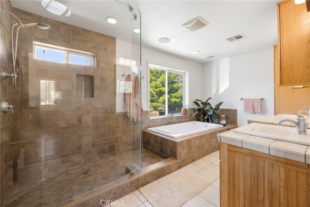 35607 Red Rover Mine Road Acton, CA 93510 - Photo 18 of 42 a bathroom with a tub sink and mirror