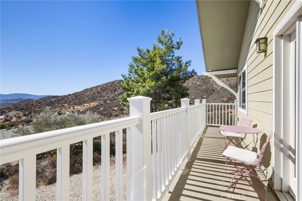 35607 Red Rover Mine Road Acton, CA 93510 - Photo 22 of 42 a view of a balcony with wooden floor and fence
