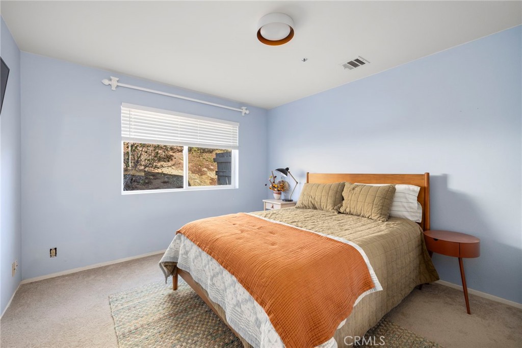 35607 Red Rover Mine Road Acton, CA 93510 - Photo 27 of 42 a large bed sitting in a bedroom next to a window