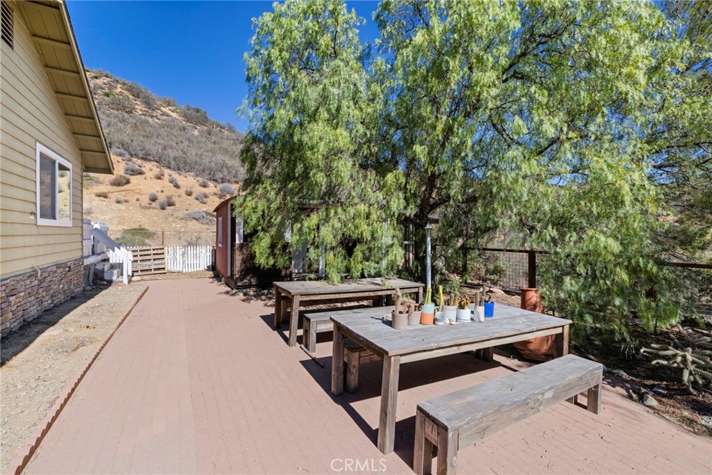 35607 Red Rover Mine Road Acton, CA 93510 - Photo 31 of 42 a view of a patio with table and chairs and potted plants