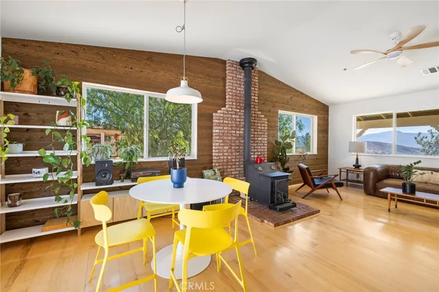 a view of a dining room with furniture window and outside view