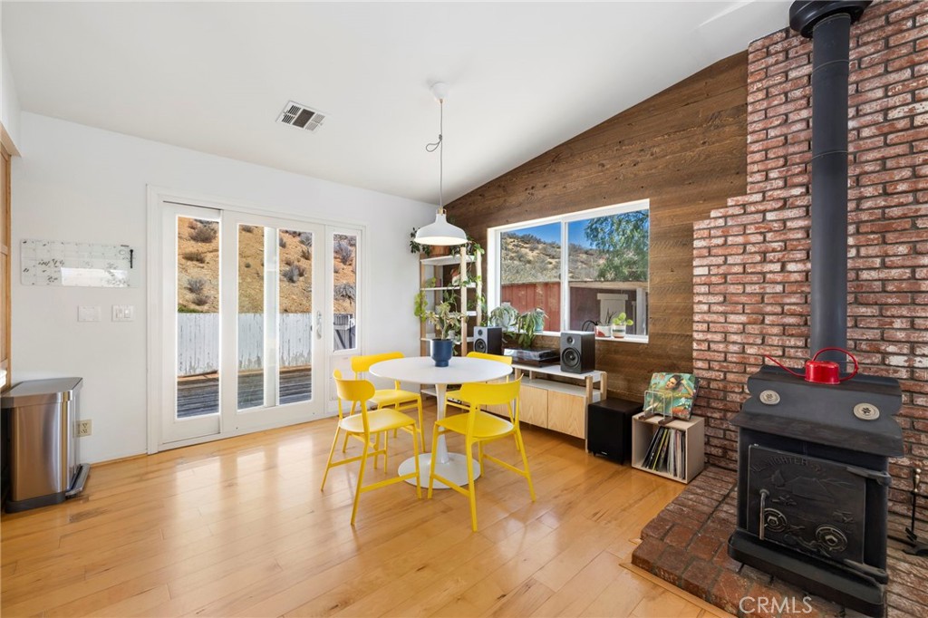 35607 Red Rover Mine Road Acton, CA 93510 - Photo 9 of 42 a living room with furniture a large window and wooden floor