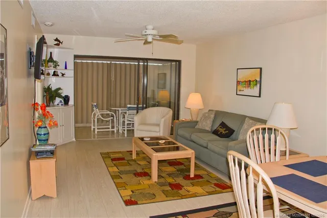 a dining room with furniture and chandelier kitchen view