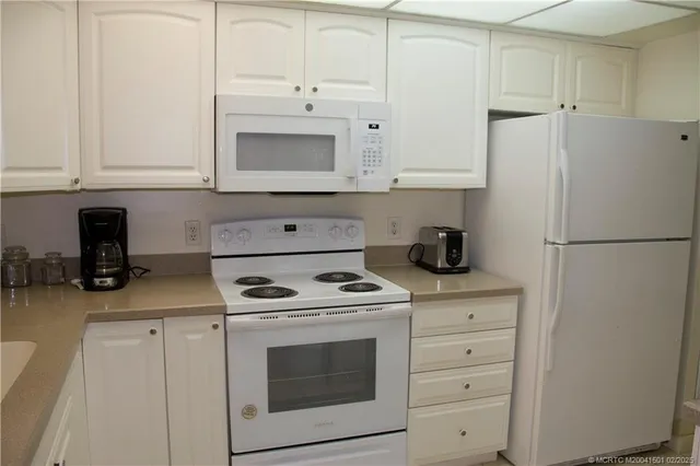 a bathroom with a sink double vanity and shower