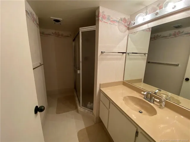 a view of a lake with a palm tree