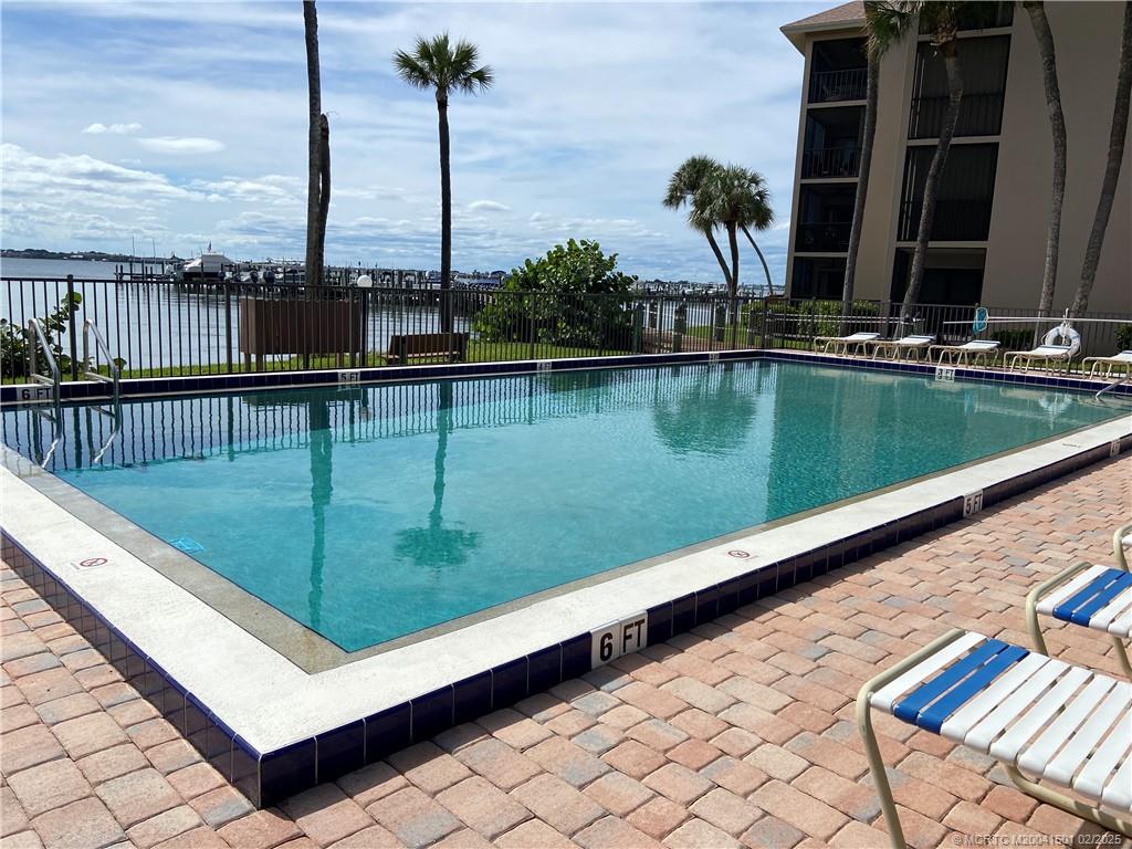 4620 Northeast Sandpebble Trace, Unit 405 Stuart, FL 34996 - Photo 26 of 26 a view of a lake with a terrace