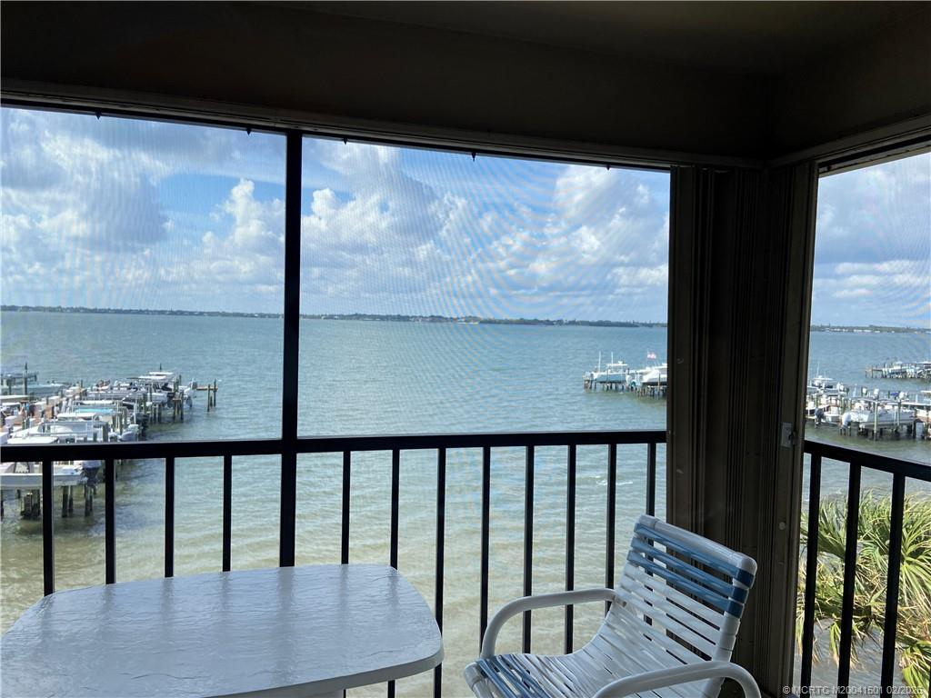 4620 Northeast Sandpebble Trace, Unit 405 Stuart, FL 34996 - Photo 5 of 26 a view of a balcony with wooden floor