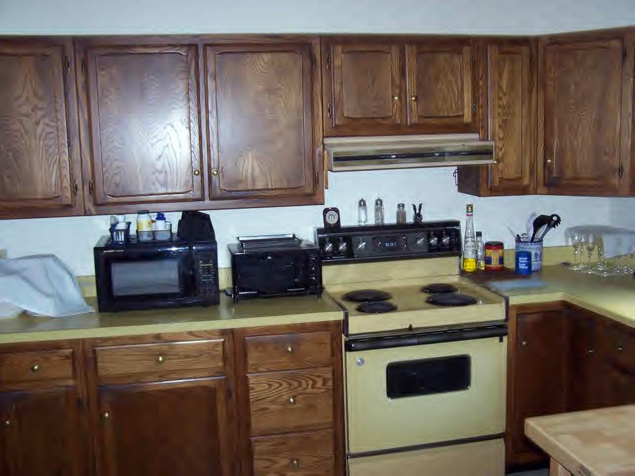 135 Rathbun Road Hancock, MA 01267 - Photo 9 of 15 a kitchen with stainless steel appliances granite countertop a stove a refrigerator a sink dishwasher and cabinets with wooden floor