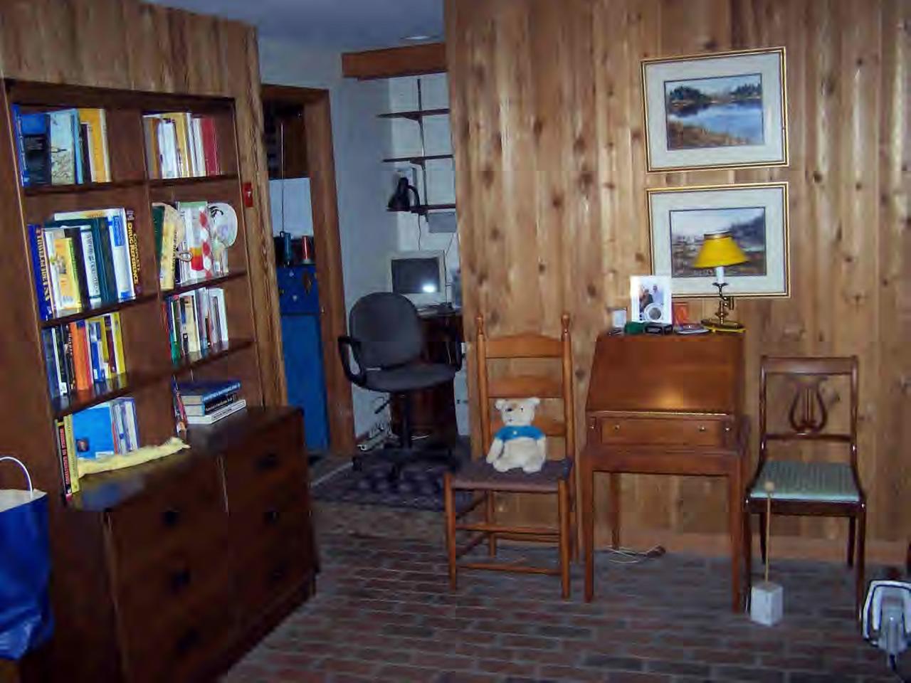 135 Rathbun Road Hancock, MA 01267 - Photo 10 of 15 a living room with furniture and a book shelf