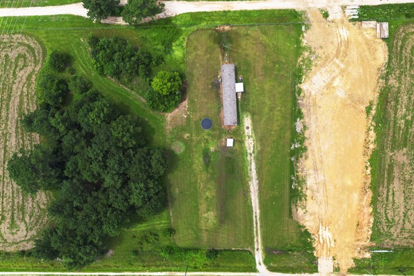 148 A Rogers Road New Waverly, TX 77358 - Photo 4 of 19 The dirt portion on the right is where a recent pipeline was buried.