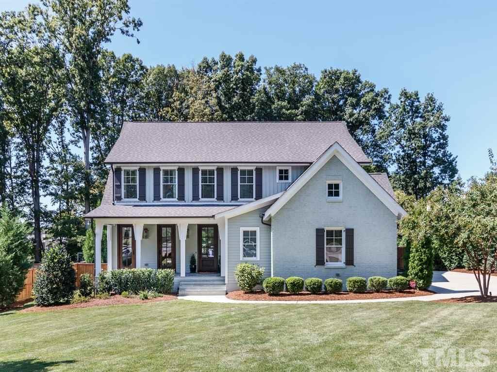 5015 Langley Circle Raleigh, NC 27609 - Photo 1 of 25 a front view of a house with a garden