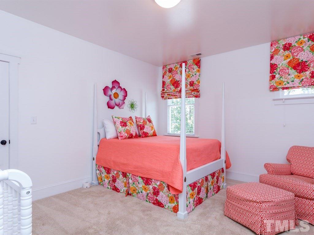 5015 Langley Circle Raleigh, NC 27609 - Photo 11 of 25 a bedroom with a bed and a couch
