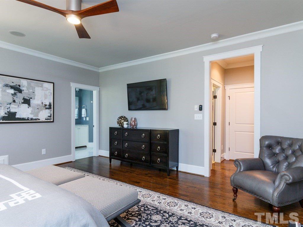 5015 Langley Circle Raleigh, NC 27609 - Photo 15 of 25 a bedroom with furniture and a flat screen tv
