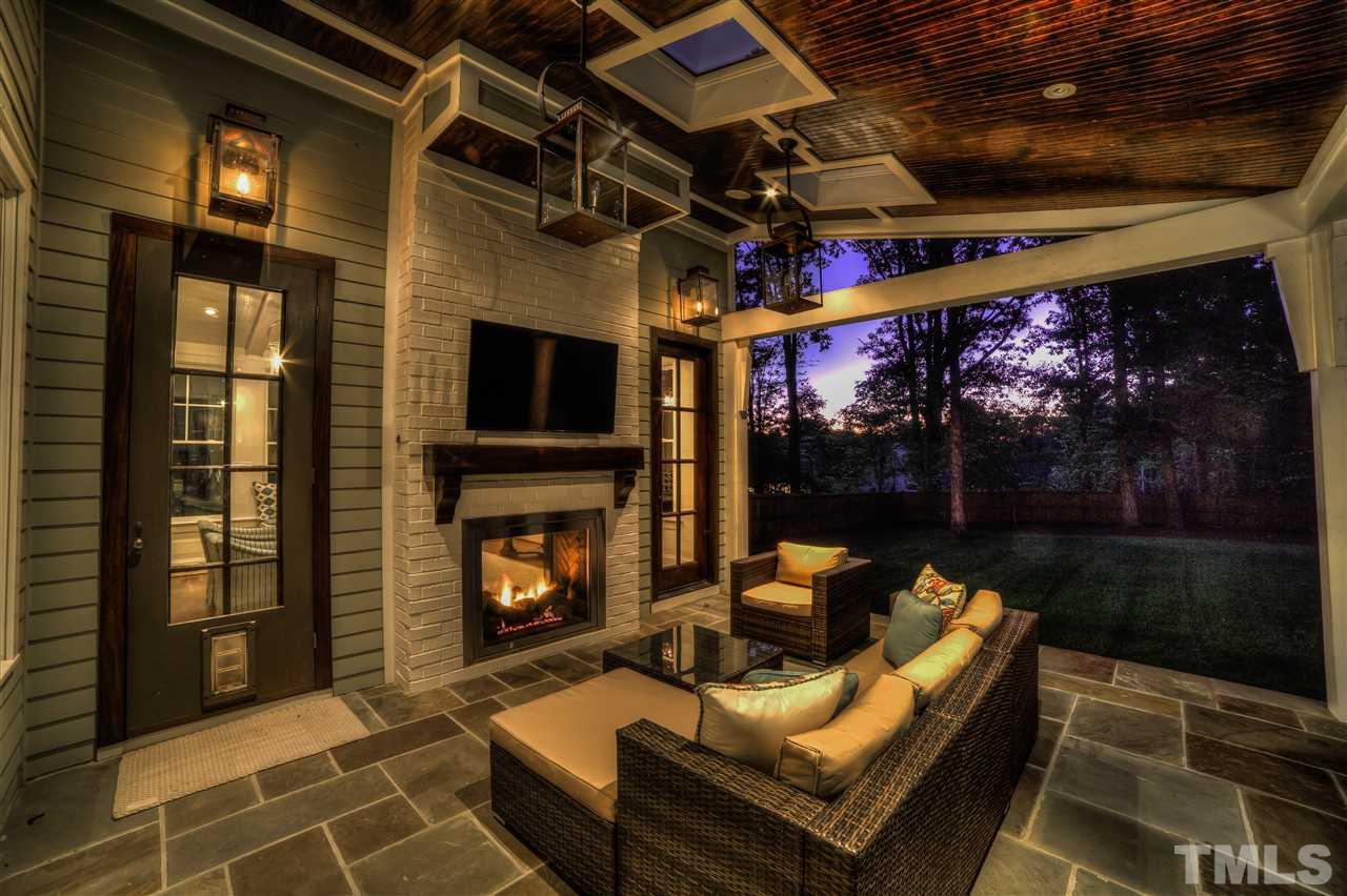 5015 Langley Circle Raleigh, NC 27609 - Photo 24 of 25 a outdoor living space with patio furniture and a fireplace
