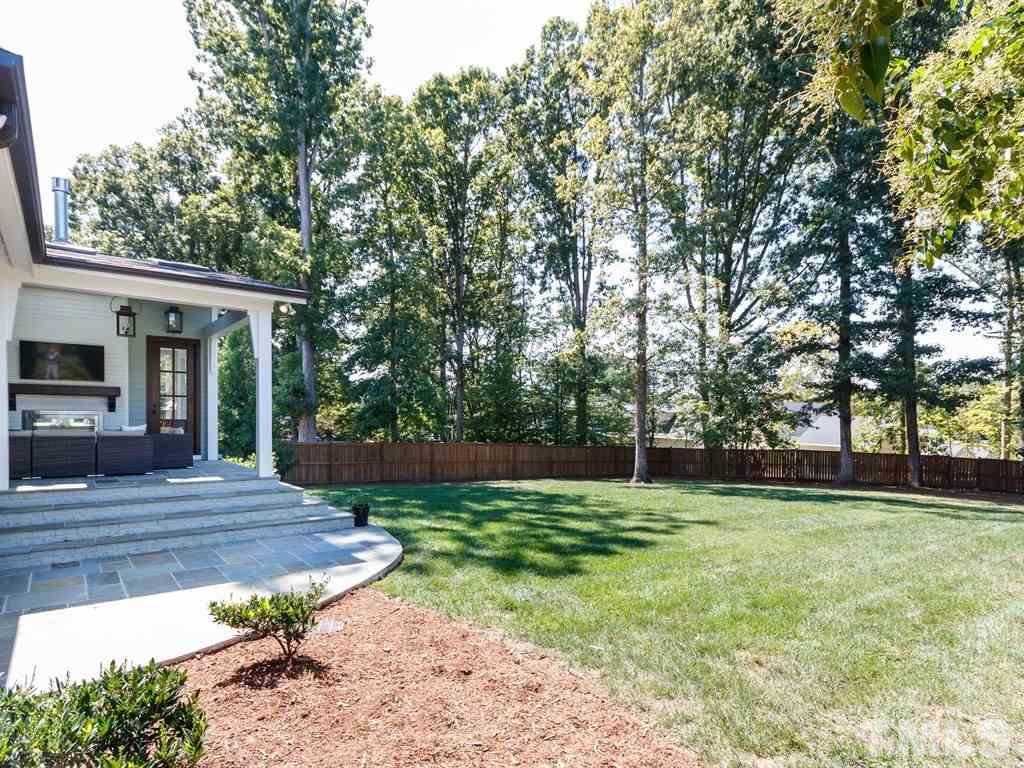 5015 Langley Circle Raleigh, NC 27609 - Photo 3 of 25 a view of a backyard with a garden
