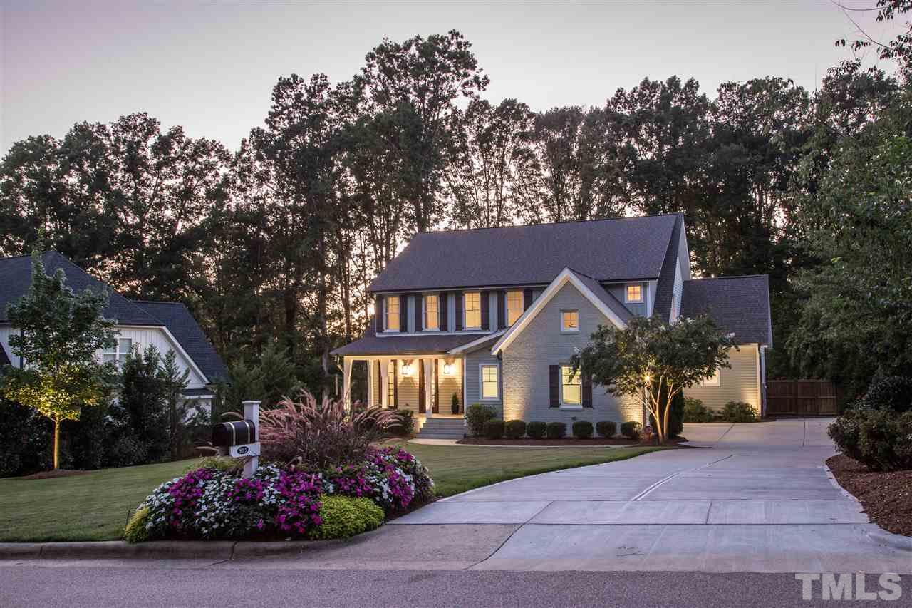 5015 Langley Circle Raleigh, NC 27609 - Photo 4 of 25 a front view of a house with a yard and a garden