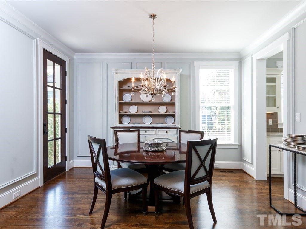 5015 Langley Circle Raleigh, NC 27609 - Photo 5 of 25 a dining room with furniture a chandelier and wooden floor