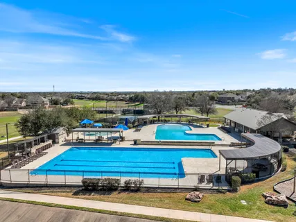a view of a swimming pool with an outdoor space